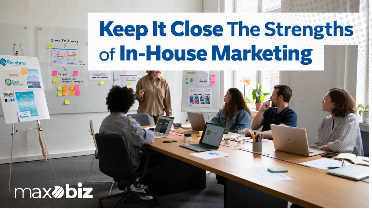 Team meeting in an office with laptops and whiteboards, featuring the text ‘Keep It Close – The Strengths of In-House Marketing’ by Maxobiz.