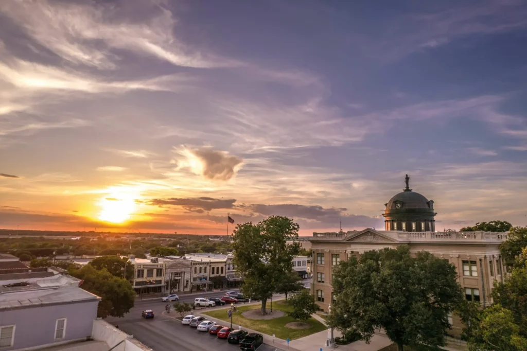 Downtown Georgetown Texas at sunset with historic architecture and vibrant street life – Maxobiz digital marketing services Georgetown Texas