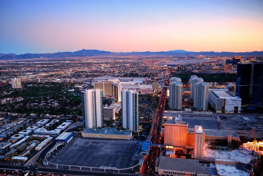 Aerial view of Fresno CA cityscape at sunset with modern buildings and glowing streets, representing the growth of digital marketing services in Fresno CA.