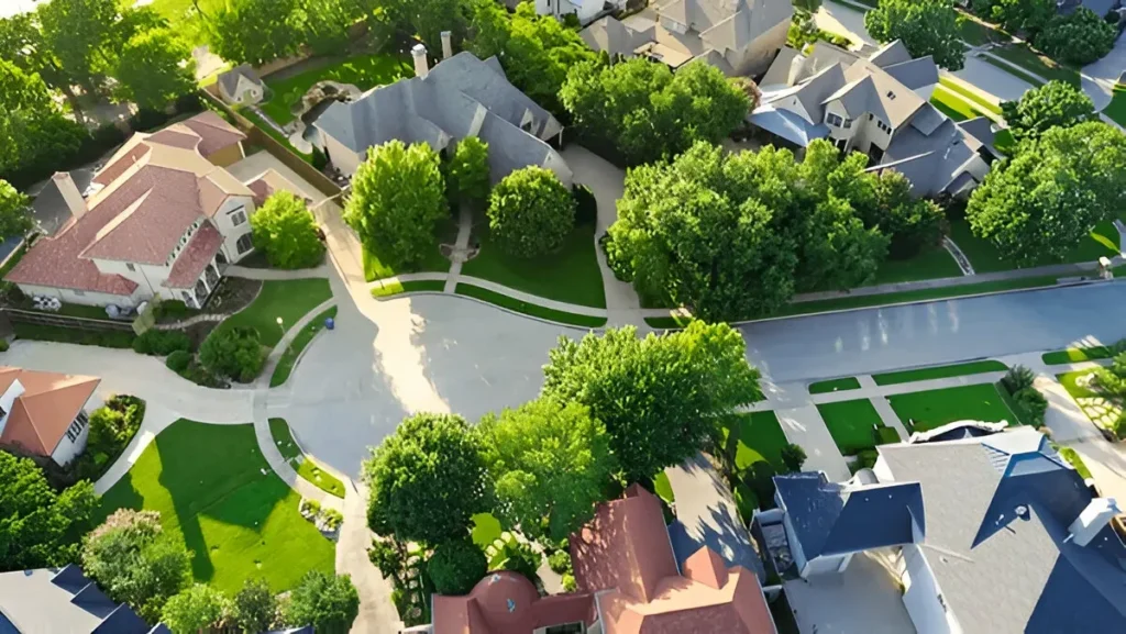 Aerial view of a residential neighborhood in Brazoria County, Texas, showcasing tree-lined streets and upscale homes — ideal for digital marketing services.