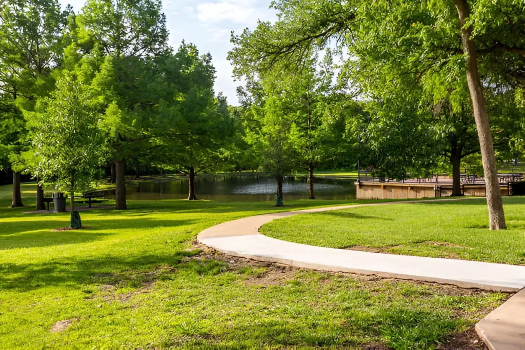 Spring Creek Nature Area in Richardson, Texas with walking trail, trees, and pond.